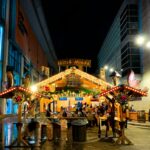 Manchester Christmas market stall decorated with festive lights