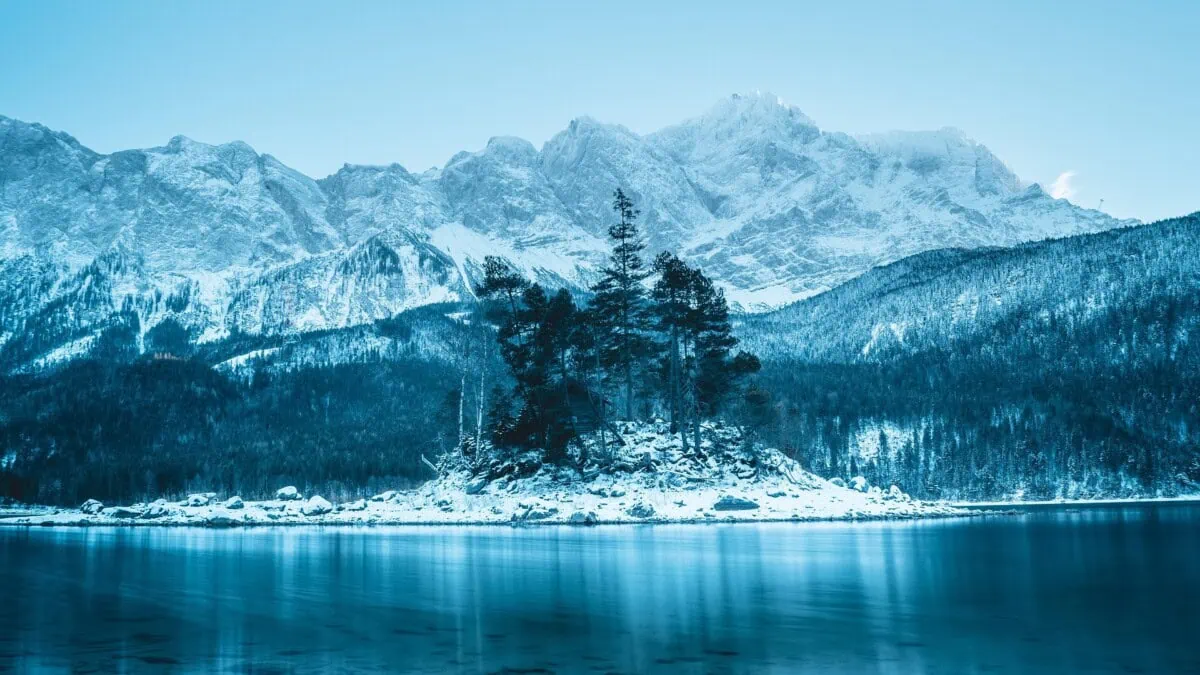 Snow-covered Bavarian Alps and alpine lake near Munich