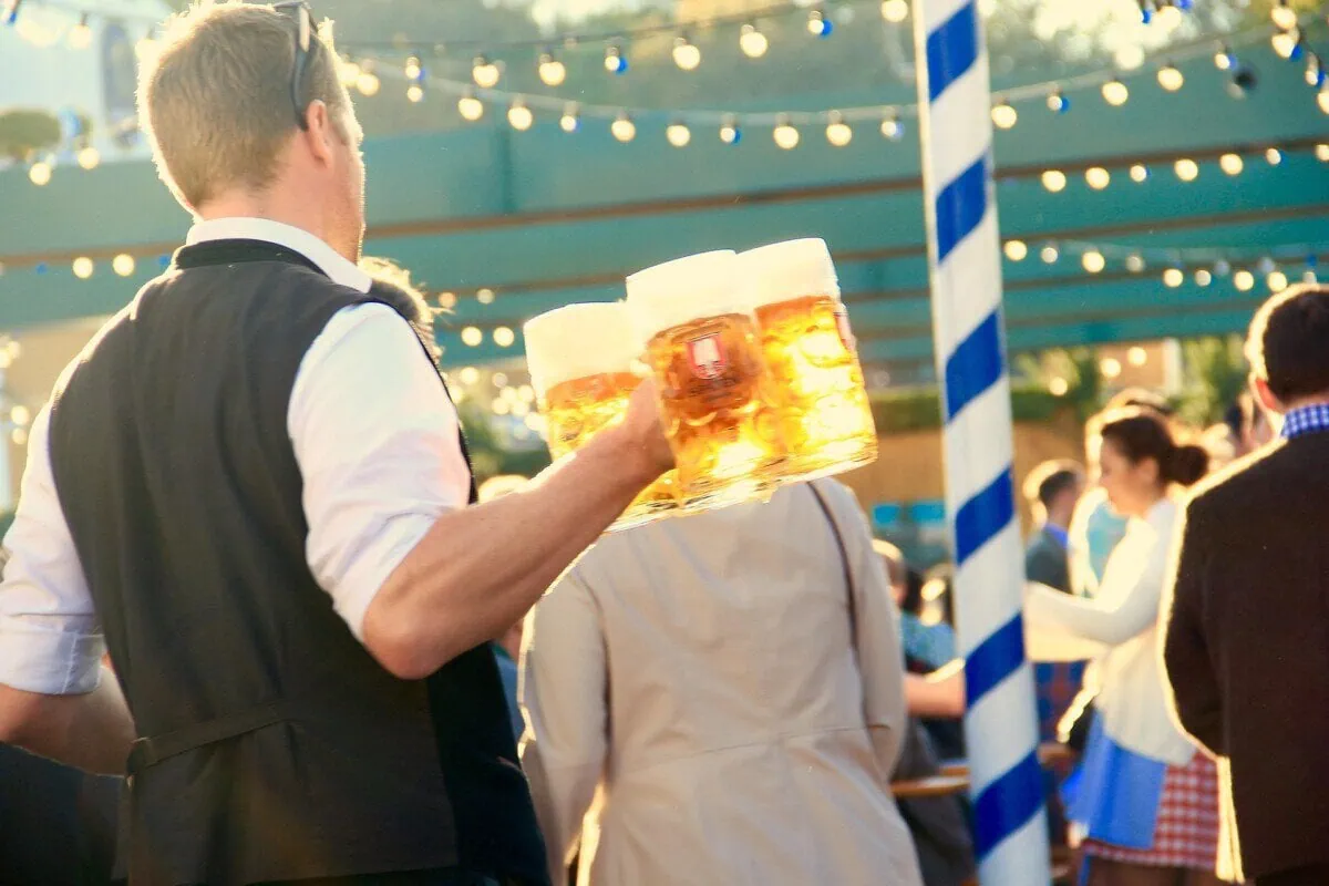 Oktoberfest server carrying beer steins in a Munich beer tent