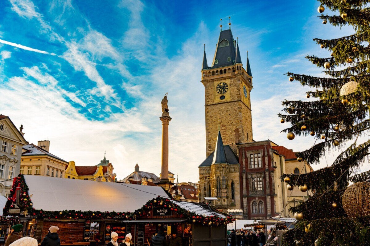 Christmas market and decorated tree in Prague Old Town Square