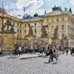 Entrance to Prague Castle with visitors outside