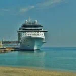 Large passenger ship docked at Rhodes port beside the old town