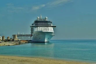 Large passenger ship docked at Rhodes port beside the old town