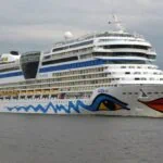 Large cruise ship sailing near Riga cruise port on the Daugava River