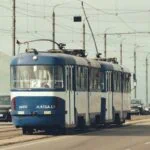Blue and white tram travelling through Riga, Latvia