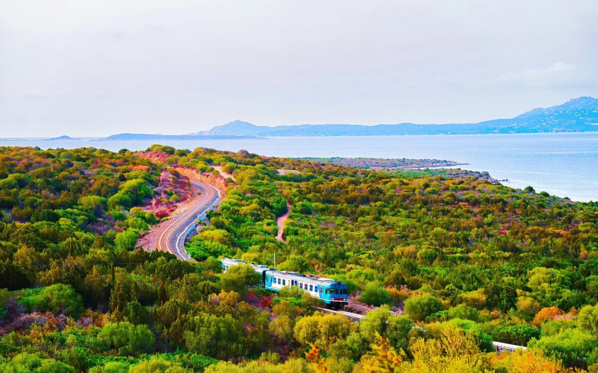 Train travelling through the Sardinian countryside near the coast