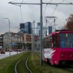 Red tram travelling through central Tallinn, Estonia