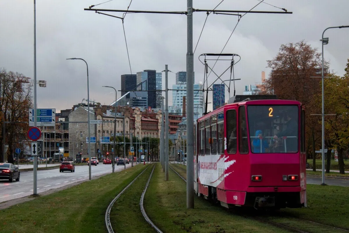 Red tram travelling through central Tallinn, Estonia