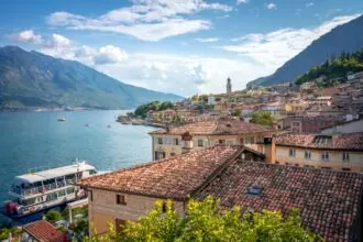 Limone sul Garda waterfront, ferry and mountains beside Lake Garda