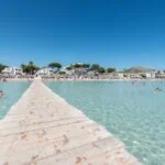 Clear shallow water and sandy beach at Alcúdia in Mallorca