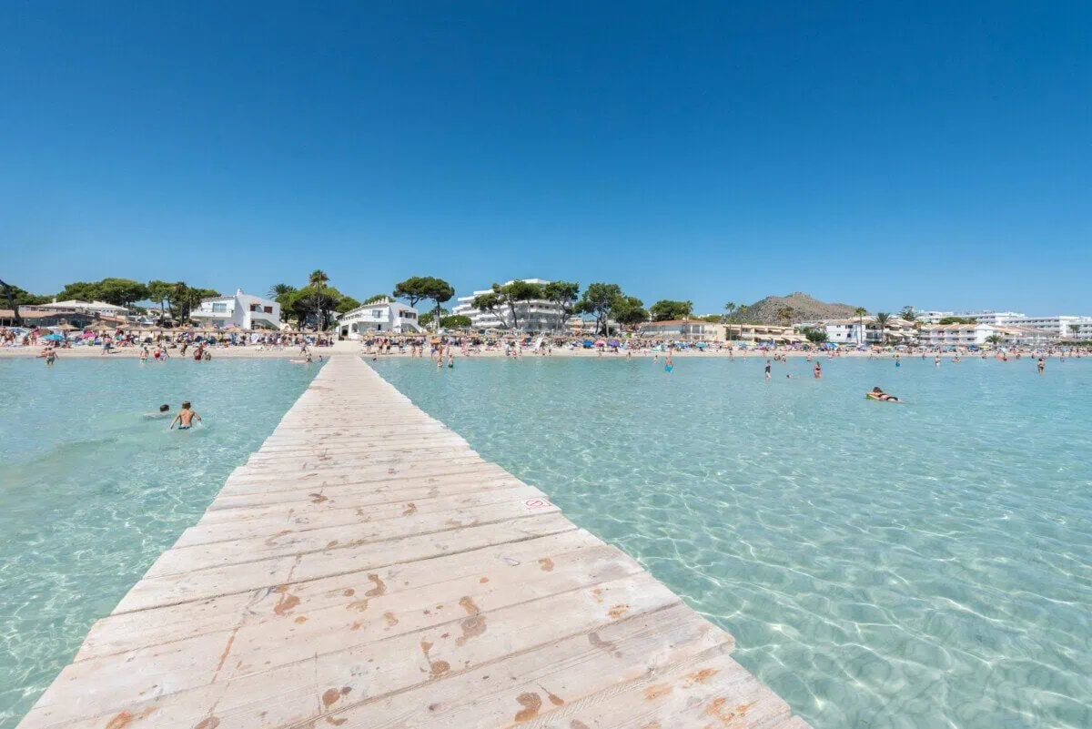 Clear shallow water and sandy beach at Alcúdia in Mallorca