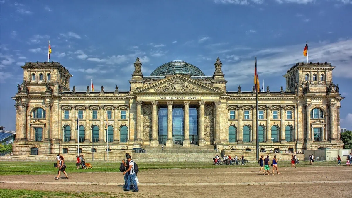 Reichstag building in Berlin under a blue sky