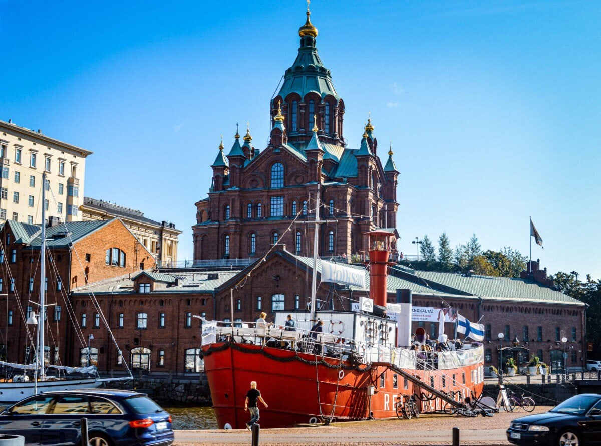 Uspenski Cathedral overlooking Helsinki waterfront with a red lightship moored in the harbour