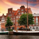 Historic waterfront buildings and boats in Lübeck