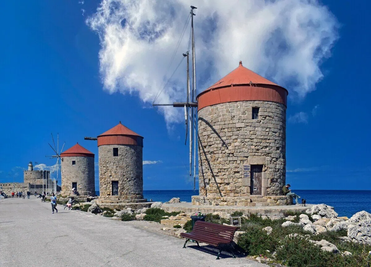 Historic stone windmills at Mandraki Harbour in Rhodes Town