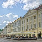 Tartu Town Hall Square with historic buildings and pavement cafes in Estonia