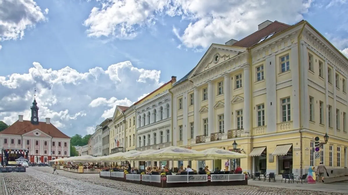 Tartu Town Hall Square with historic buildings and pavement cafes in Estonia