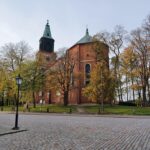 Turku Cathedral surrounded by autumn trees in Turku, Finland