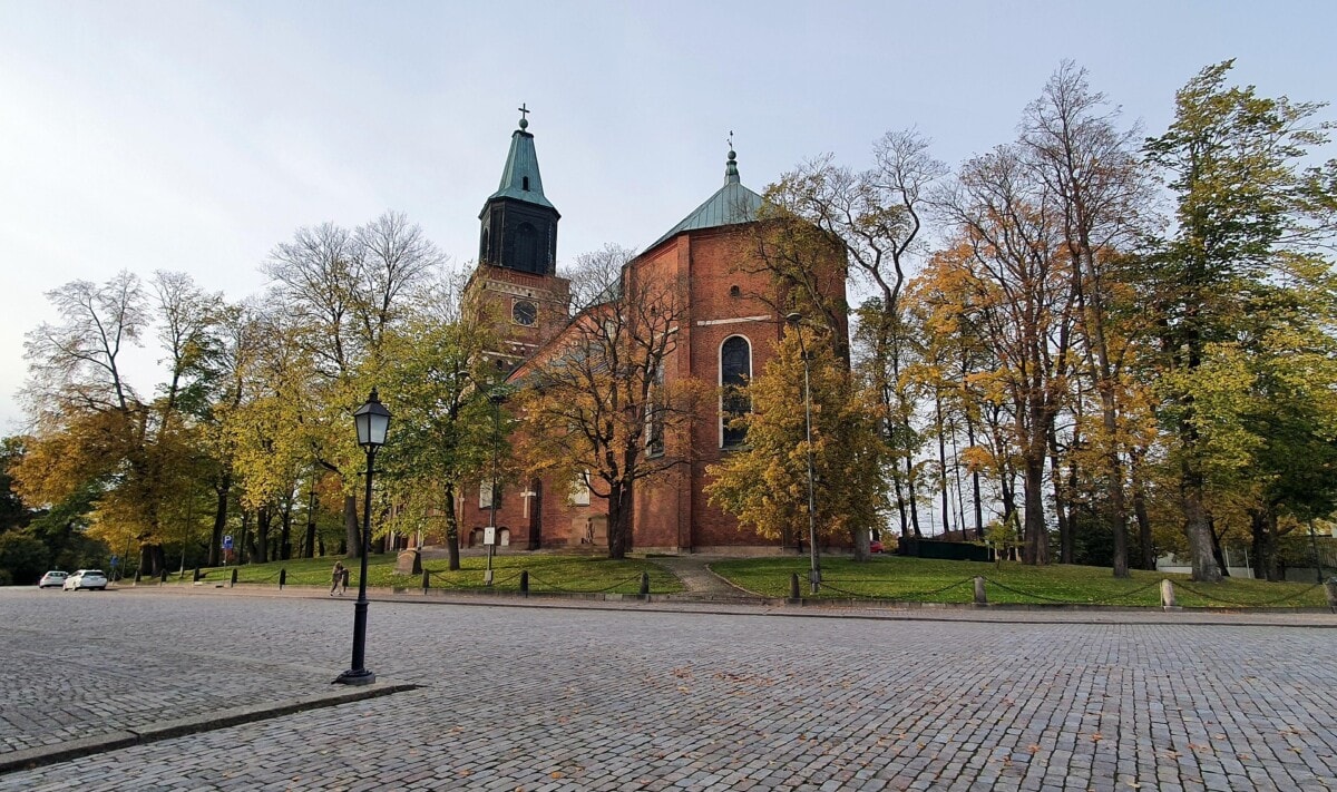 Turku Cathedral surrounded by autumn trees in Turku, Finland