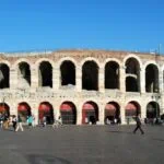 Roman Arena di Verona amphitheatre in Piazza Bra under a clear blue sky