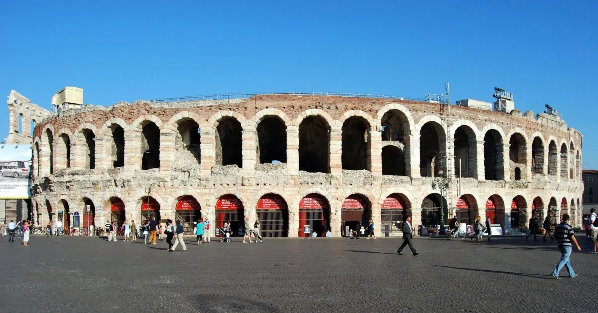 Roman Arena di Verona amphitheatre in Piazza Bra under a clear blue sky