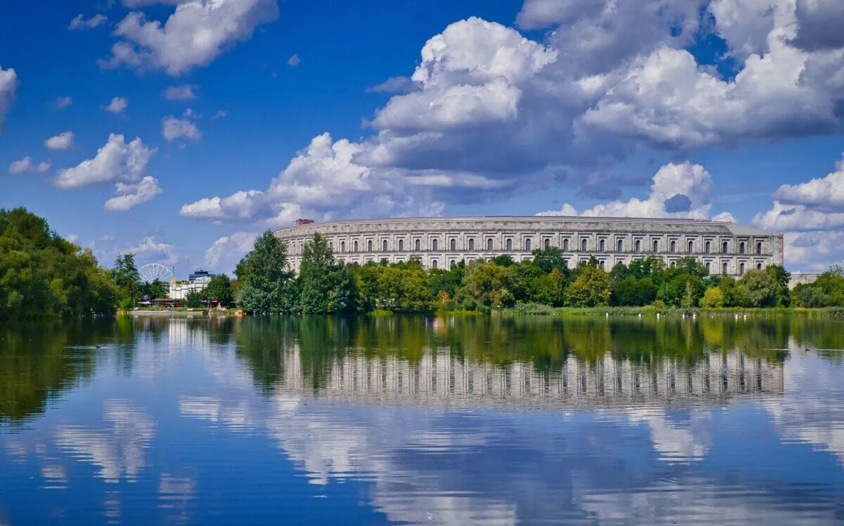 Nuremberg Congress Hall beside the Dutzendteich lake under a blue sky
