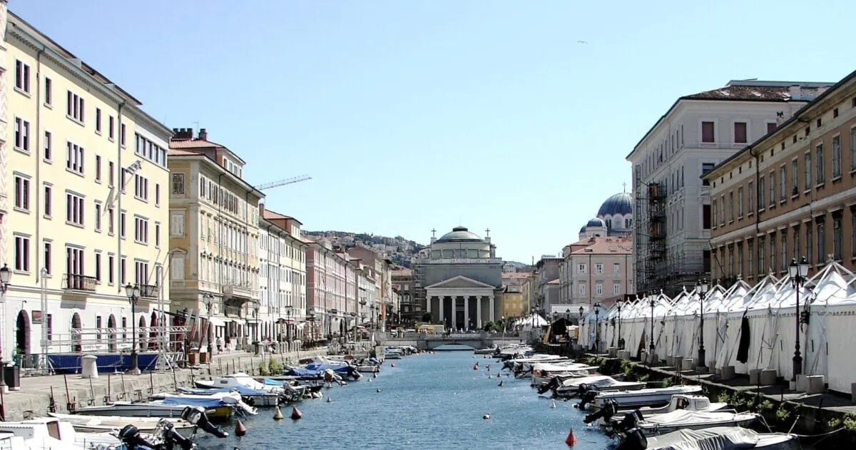 Canal Grande in central Trieste lined with boats and historic buildings