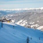 Snow-covered ski slopes and chairlifts in the Dolomites