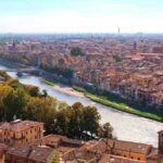 Panoramic view of Verona rooftops, church towers and the River Adige