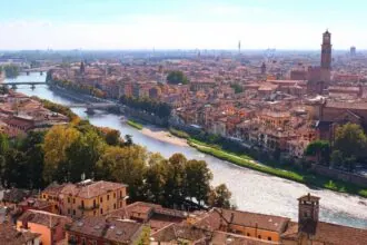 Panoramic view of Verona rooftops, church towers and the River Adige