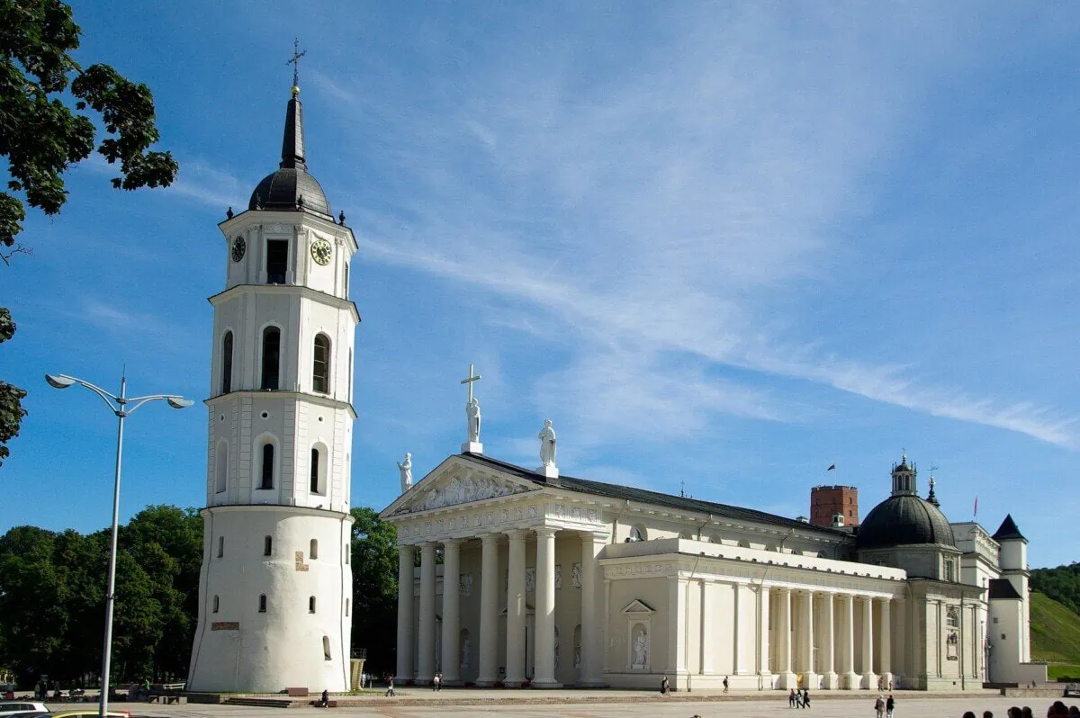 Vilnius Cathedral and its white bell tower beneath a clear blue sky